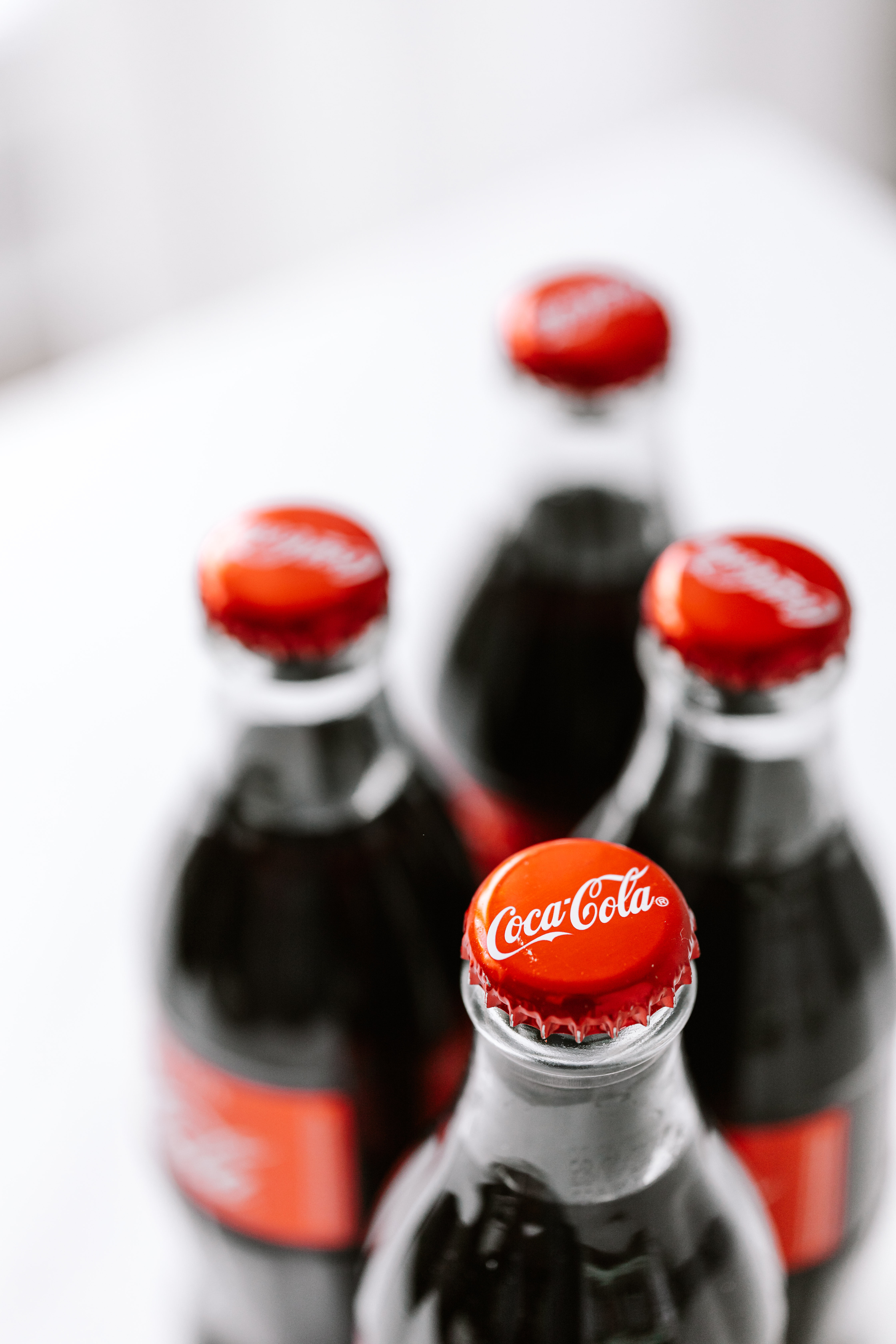 Fresh soft coke drink on white surface